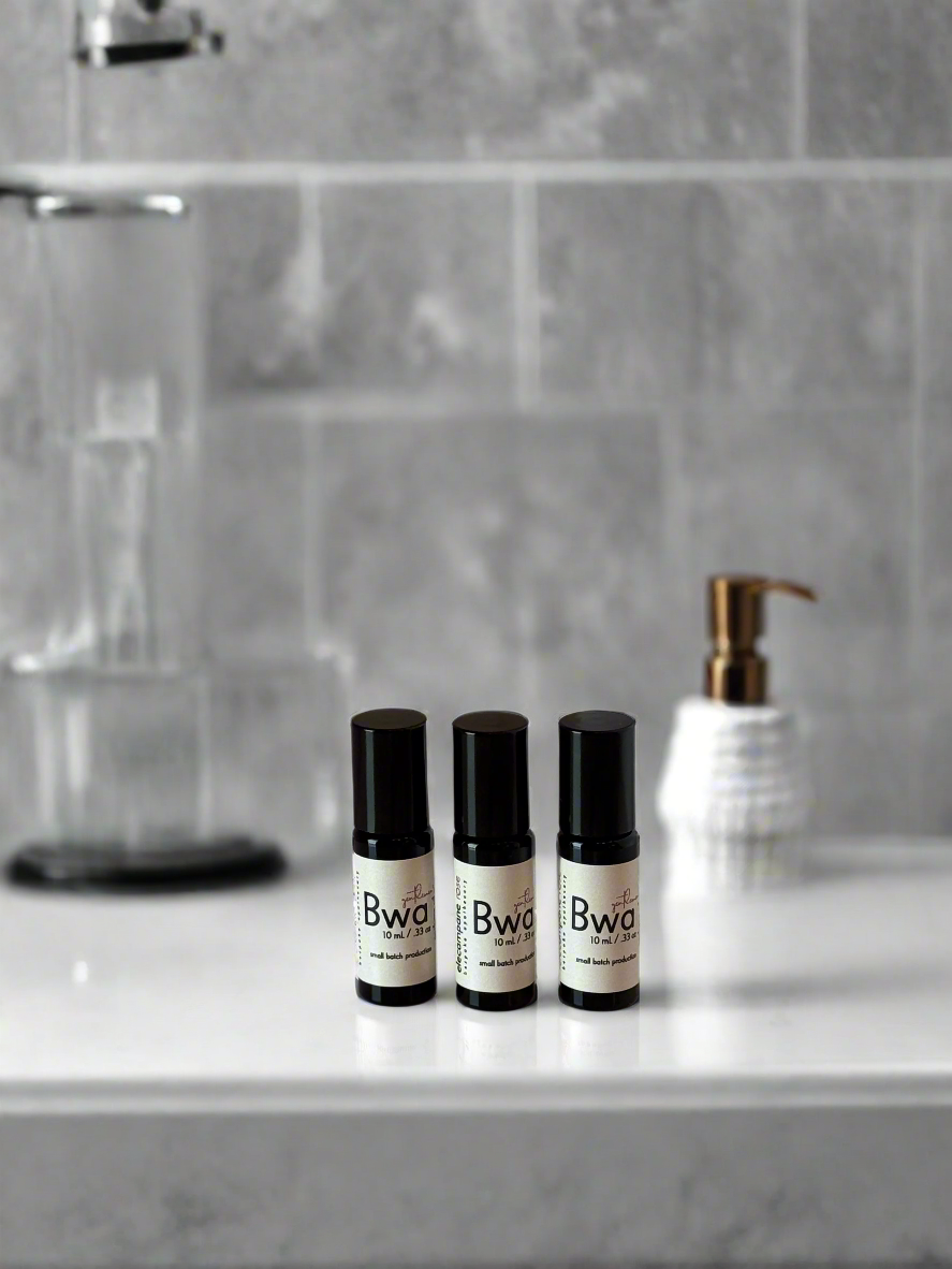 Three black and white bottles labeled &