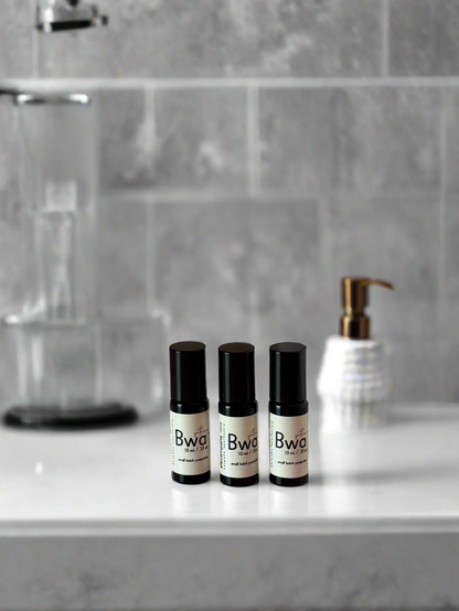 Three black and white bottles labeled &