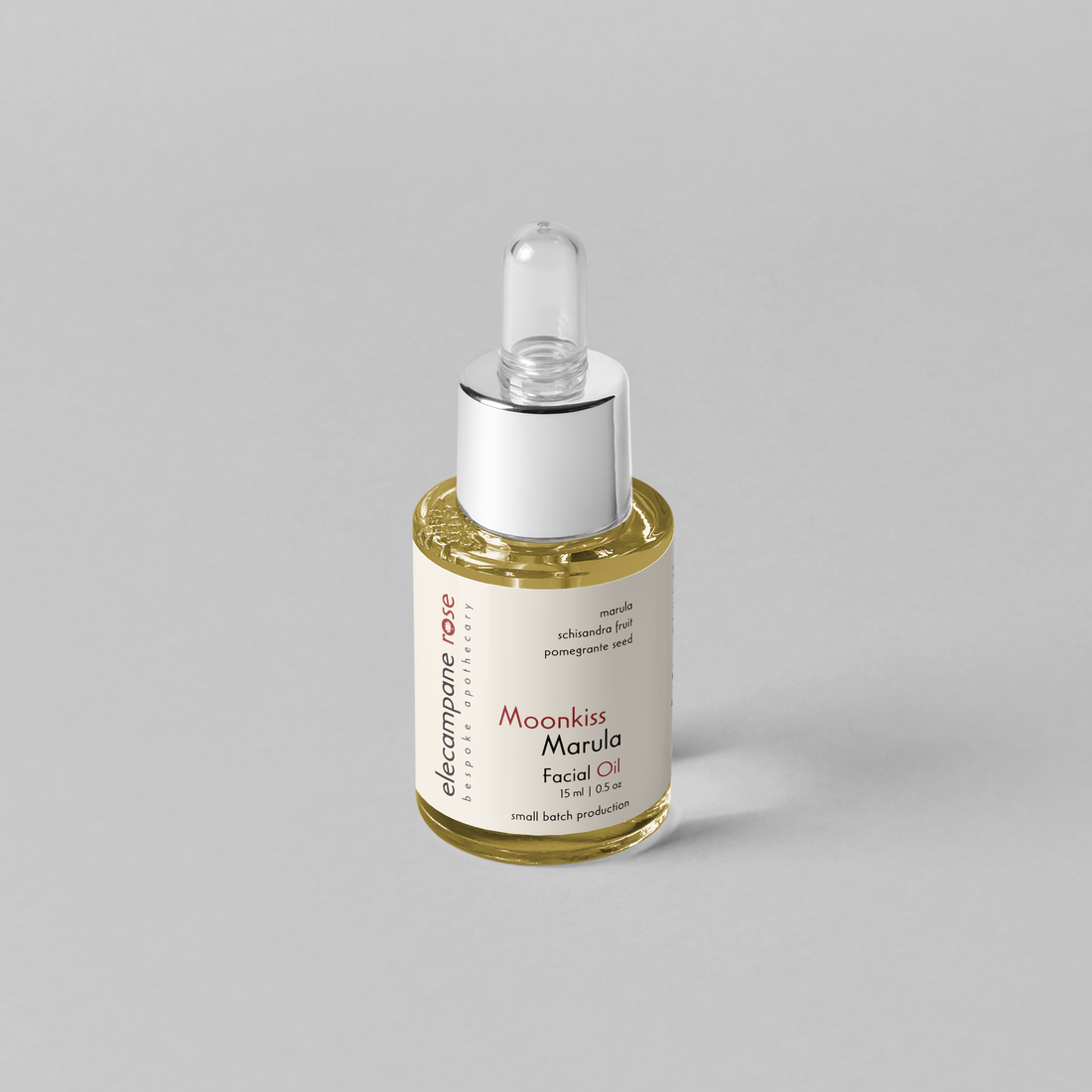 small glass dropper bottle of facial oil